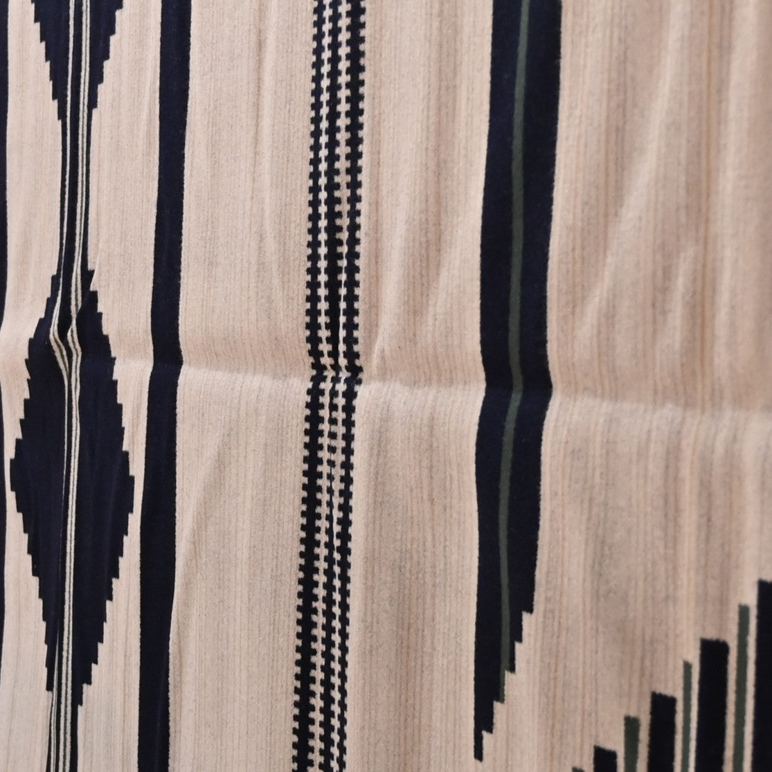View of Pendleton robe-size blanket in navy and white jacquard wool blend