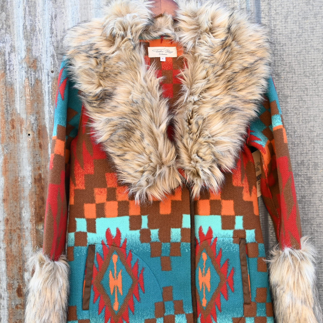 Tasha Polizzi Casey Coat in geometric orange, red, turquoise, and brown wool with removable faux fur collar and cuffs