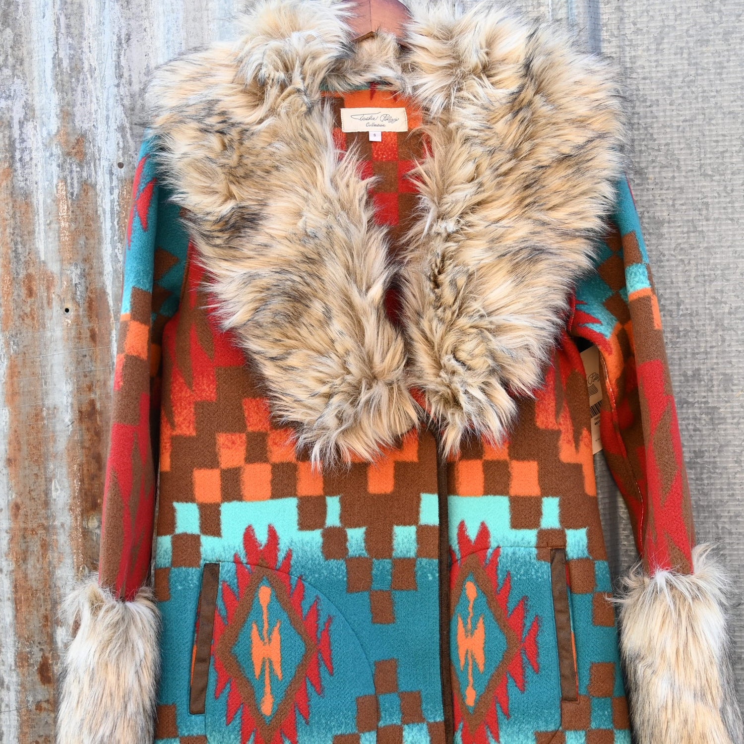 Tasha Polizzi Casey Coat in geometric orange, red, turquoise, and brown wool with removable faux fur collar and cuffs
