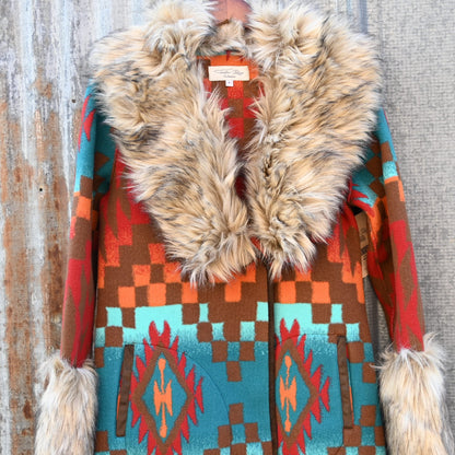 Tasha Polizzi Casey Coat in geometric orange, red, turquoise, and brown wool with removable faux fur collar and cuffs