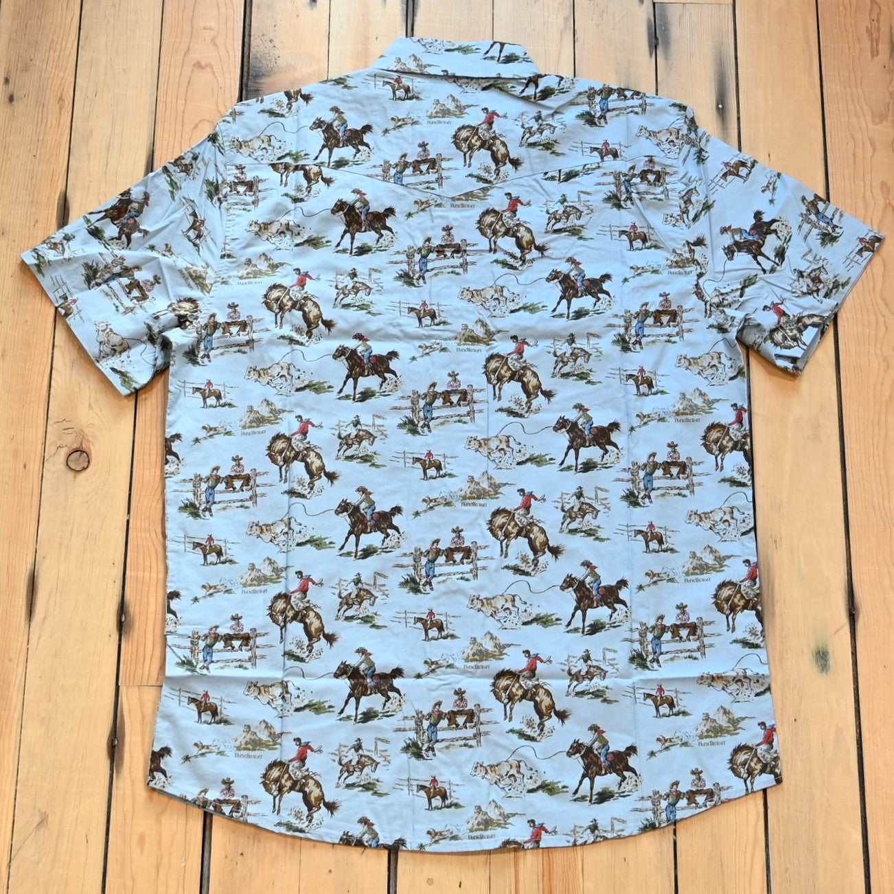 Men’s short-sleeve Laramie shirt in Wild Horses pattern with snap front, peaked yokes, and classic fit