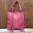 American Darling Leather Shoulder Bag with Fringe Details in Fuchsia view of front