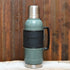 Stanley Legacy QuadVac thermal bottle in hammertone green with wrap and steel cup