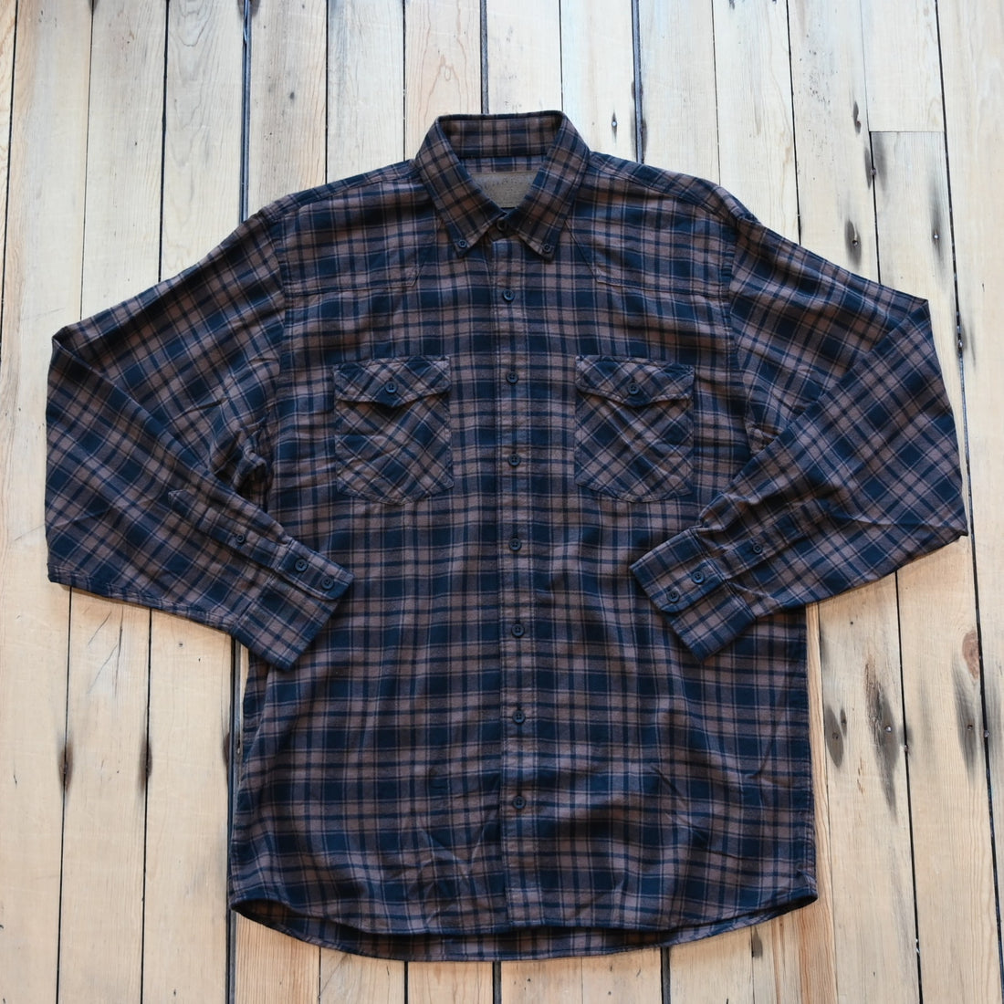 View of Schaefer bark black flannel shirt with button-down front and Western styling