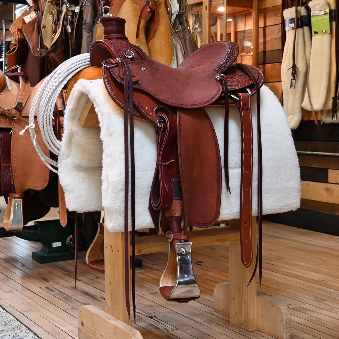 View of Deeter 3B Visalia Chestnut Saddle with floral border tooling