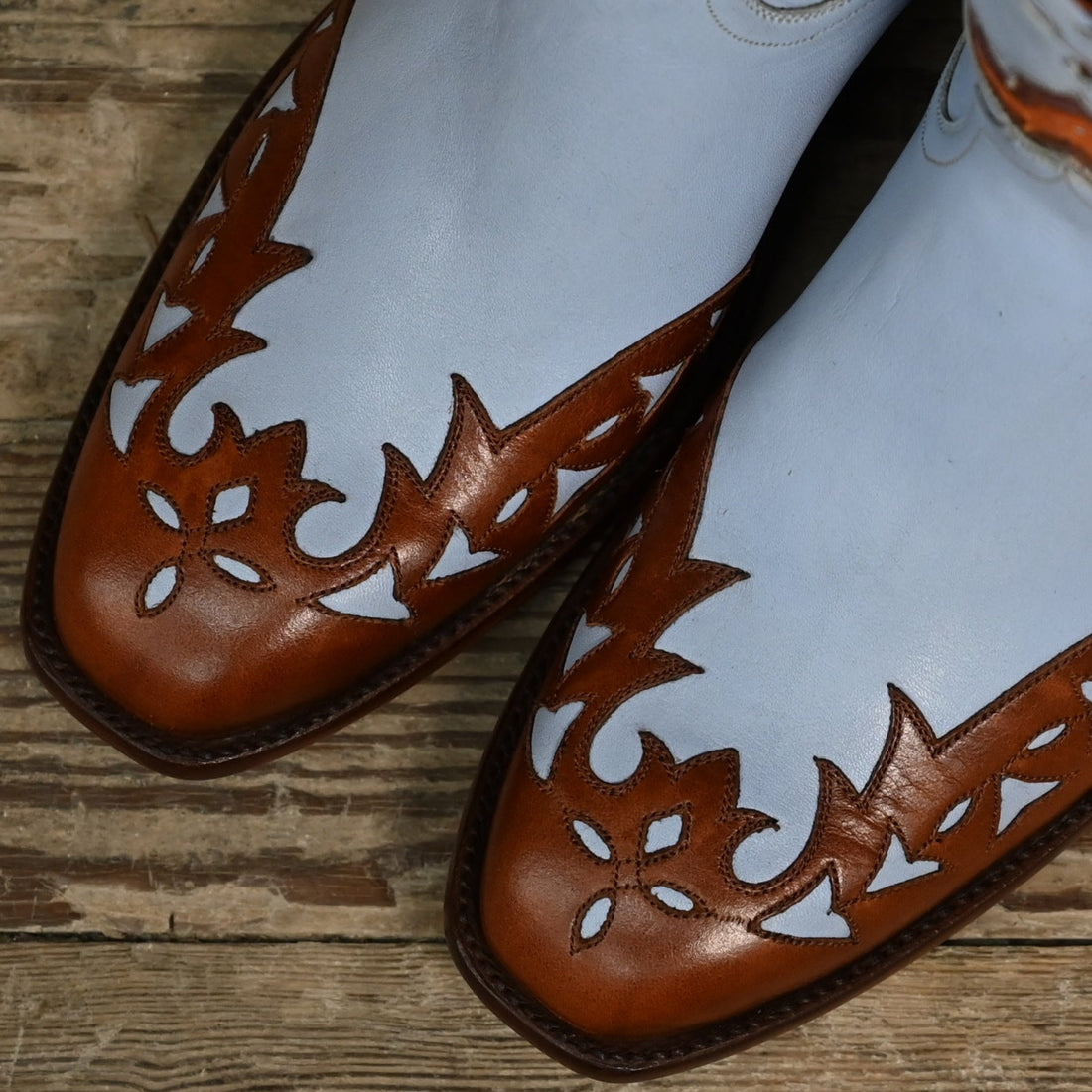 View of Stallion Ladies 9" Peewee boot in powder blue calf with vintage wingtip and combo heel