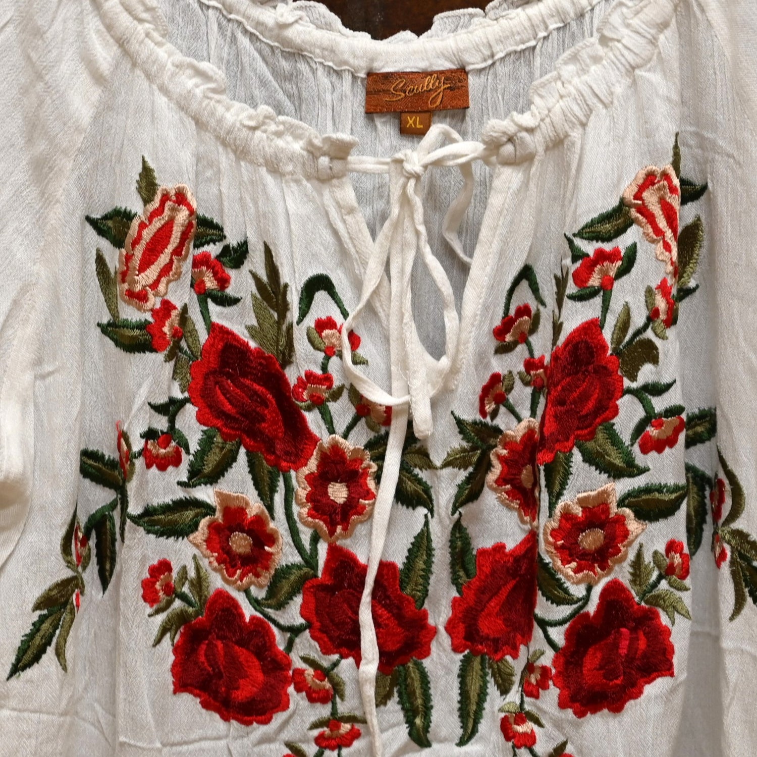 Ladies Short Sleeve Tie Front Embroidered Blouse in White view of detail