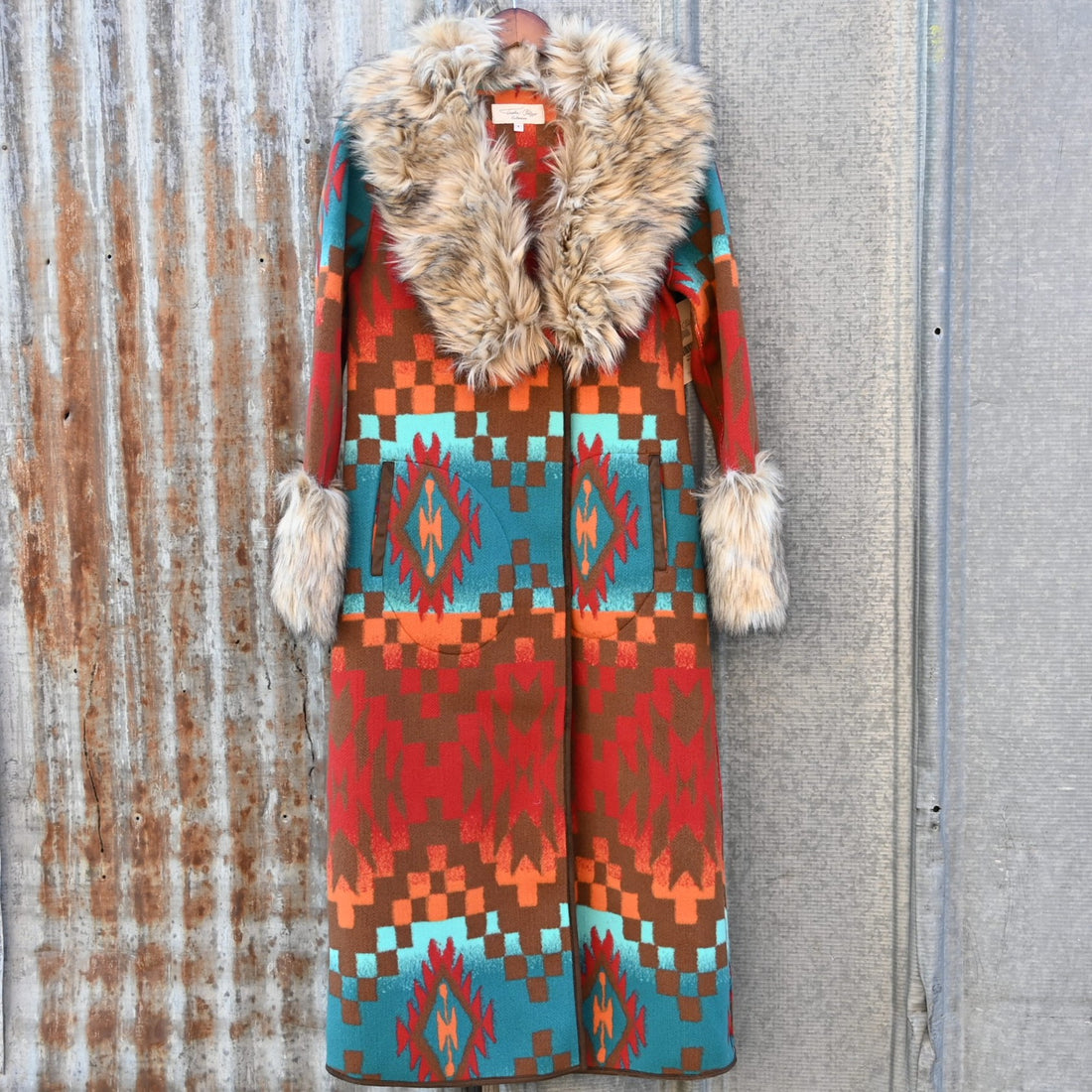 Tasha Polizzi Casey Coat in geometric orange, red, turquoise, and brown wool with removable faux fur collar and cuffs