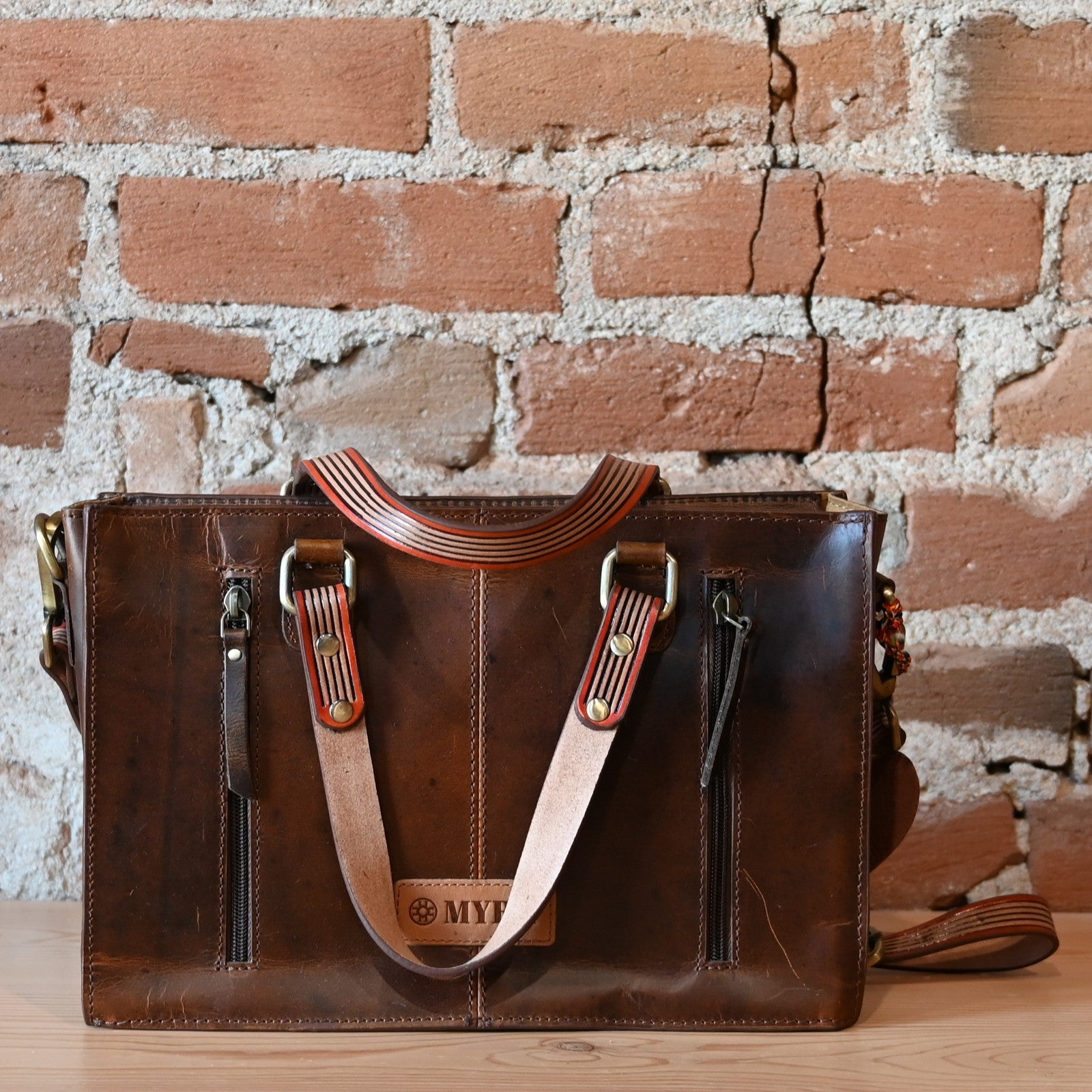Myra Savanna Ember handtooled concealed carry bag in caramel leather