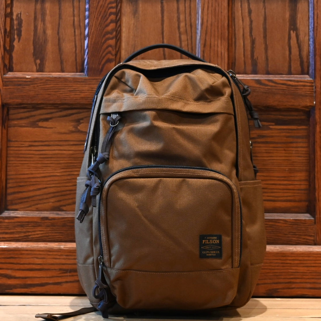 Filson Dryden Backpack in whiskey Cordura nylon with leather accents and multiple compartments