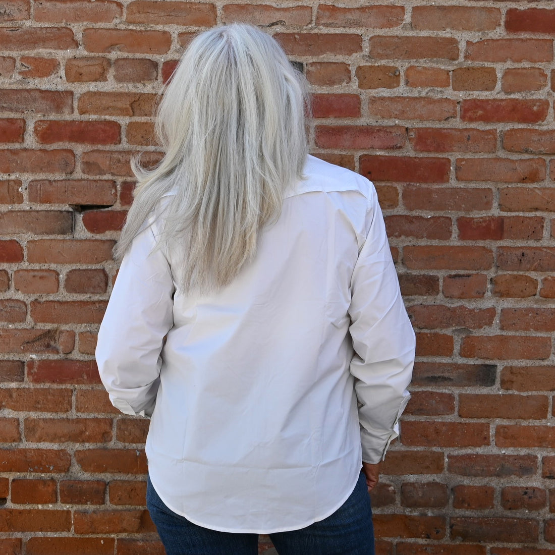 View of Schaefer white Range Tek shirt with snap front, mesh back vent, and functional chest pockets