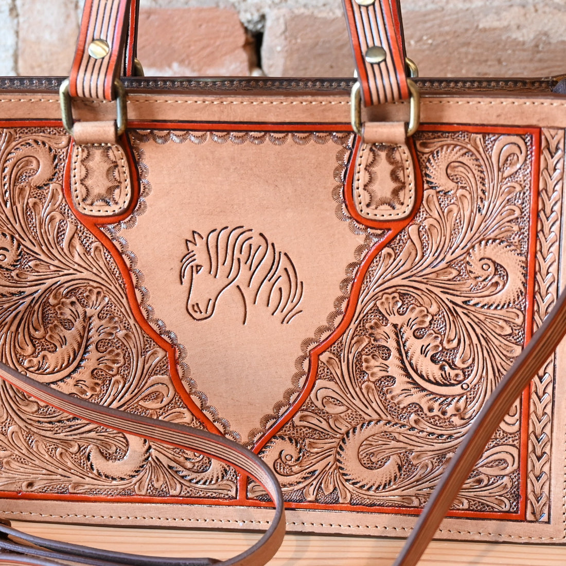 Myra Savanna Ember handtooled concealed carry bag in caramel leather