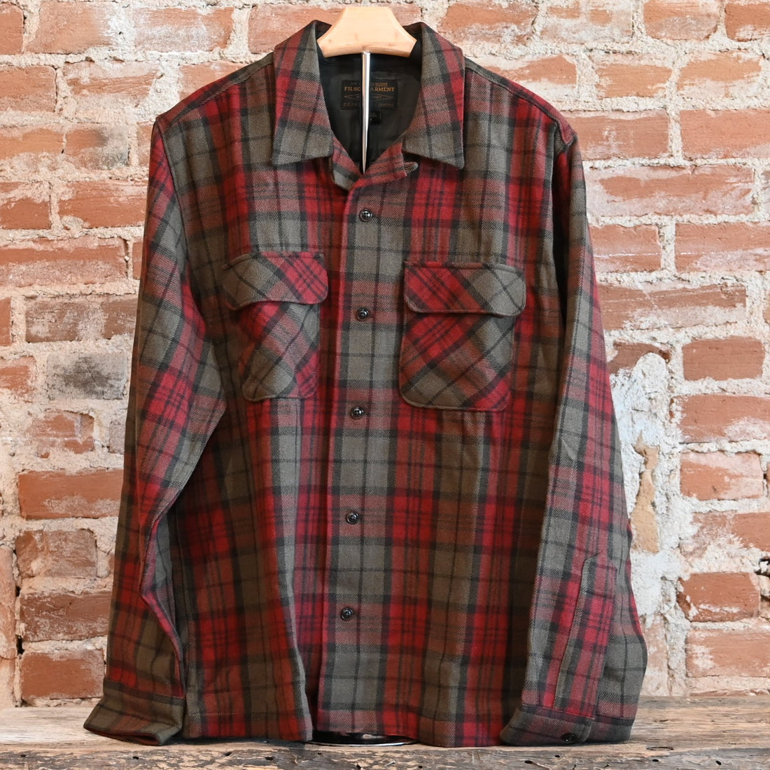 View of Filson Buckner Wool Camp Shirt in Olive Red Multi Plaid featuring unstructured camp collar and button-flap chest pockets