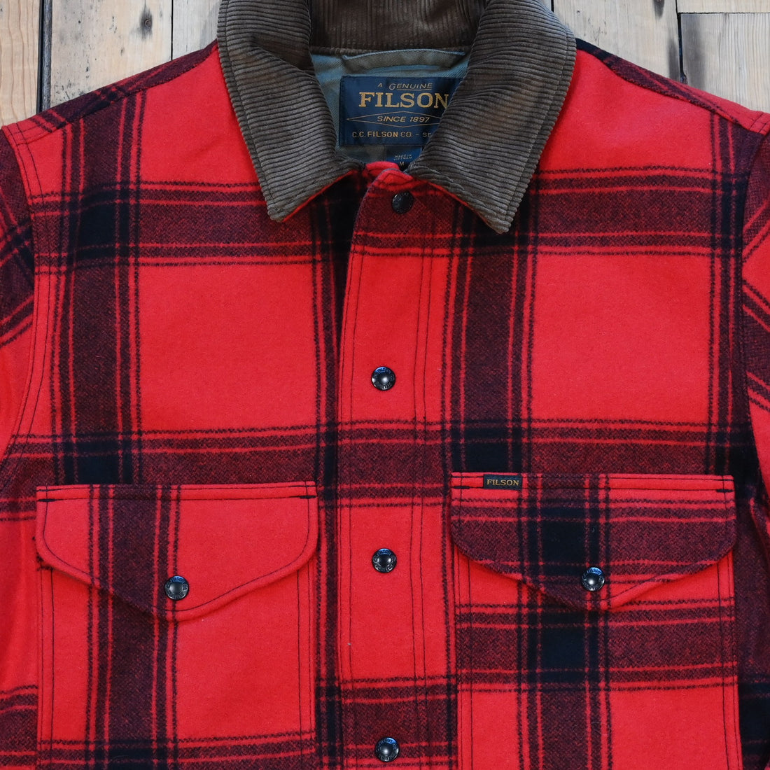 Filson Spokane Insulated Cruiser Jacket in red/black windowpane with snap front and flap pockets