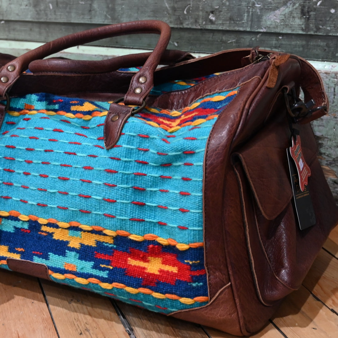 American Darling Blue Saddle Blanket Duffel Bag with genuine leather trim and multicolor Southwestern pattern