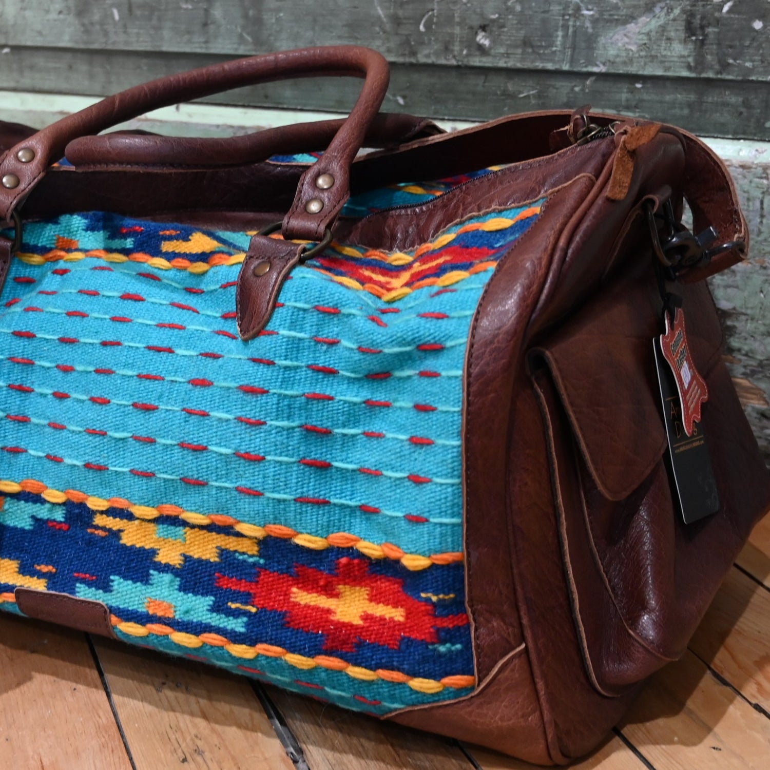 American Darling Blue Saddle Blanket Duffel Bag with genuine leather trim and multicolor Southwestern pattern