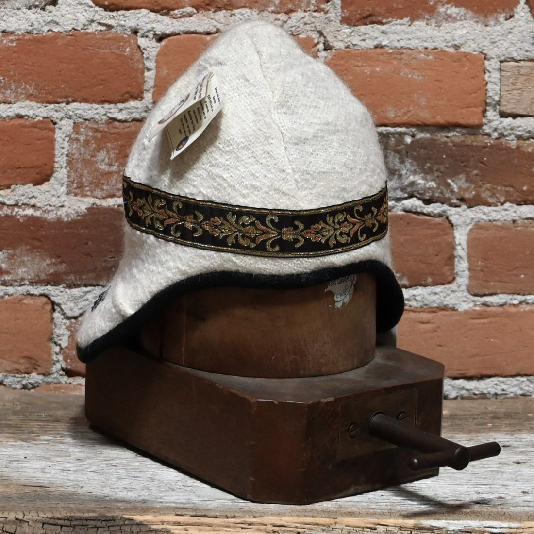 Wool hat with ear flap and decorative band view of hat