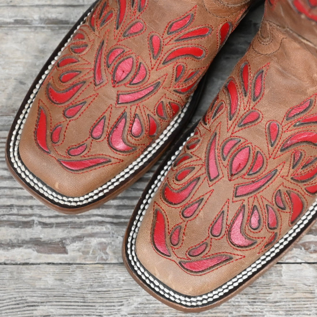 View of Hondo 13" cowboy boot in maple vintage leather with red inlays and wide square toe