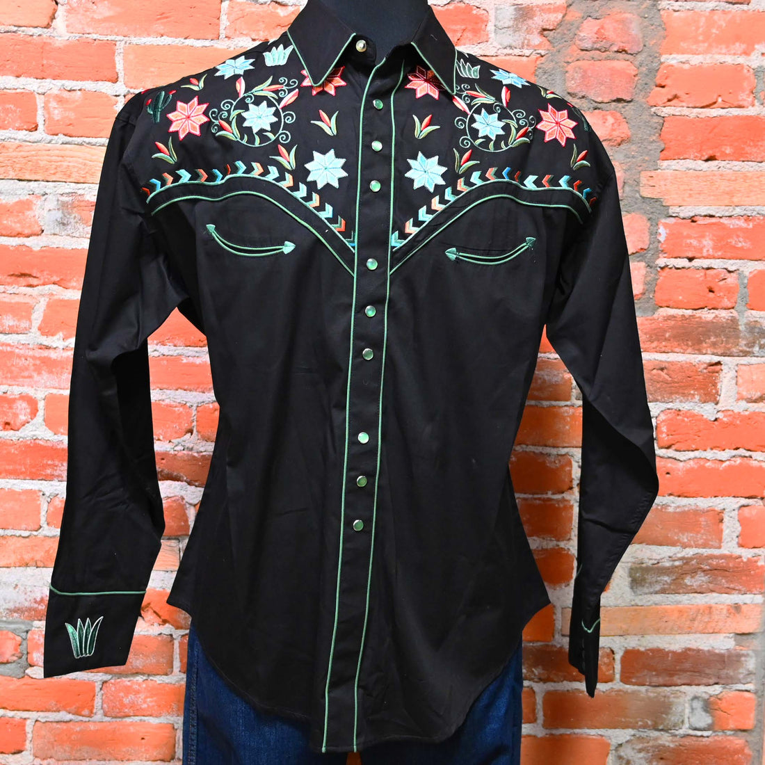 View of Black western shirt with embroidered floral, agave, and cactus motifs and Western piping