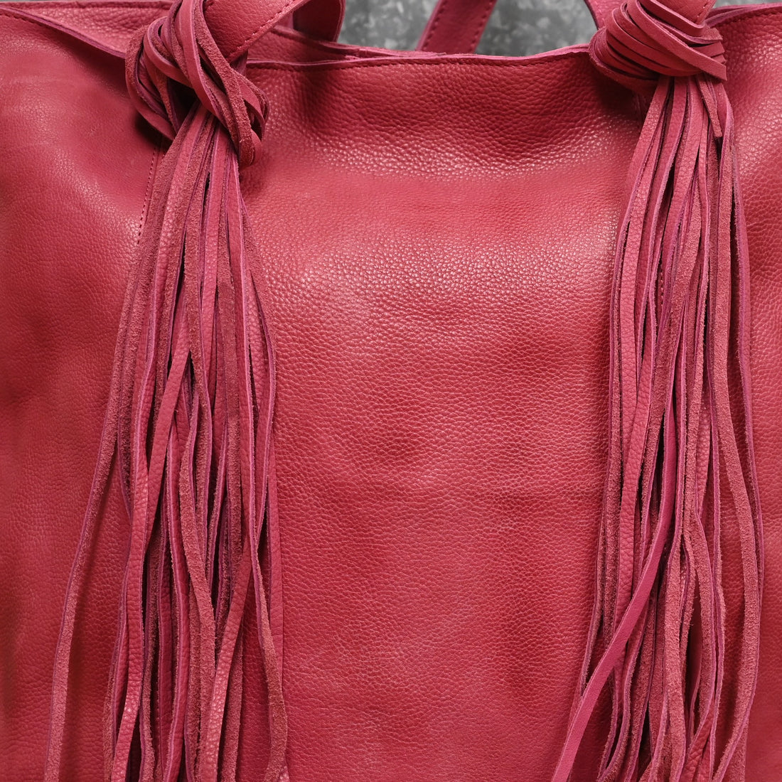 American Darling Leather Shoulder Bag with Fringe Details in Fucia view of details