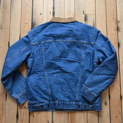 View of Wrangler sherpa-lined denim jacket in Antique Indigo with vintage wash and straight yoke