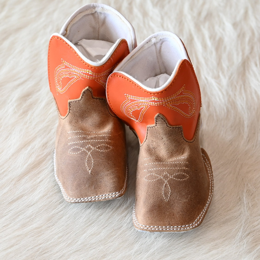 View of Anderson Bean Baby Bean boot with tan Crazy Horse vamp, tangerine top, and soft sole