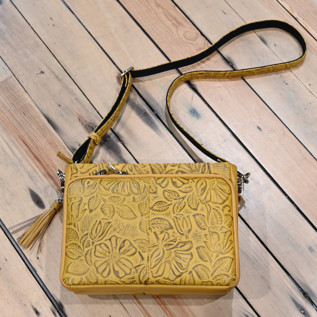 Mustard debossed USA cowhide conceal carry clutch by Gun Toten Mamas with rose leaf pattern and zipper access