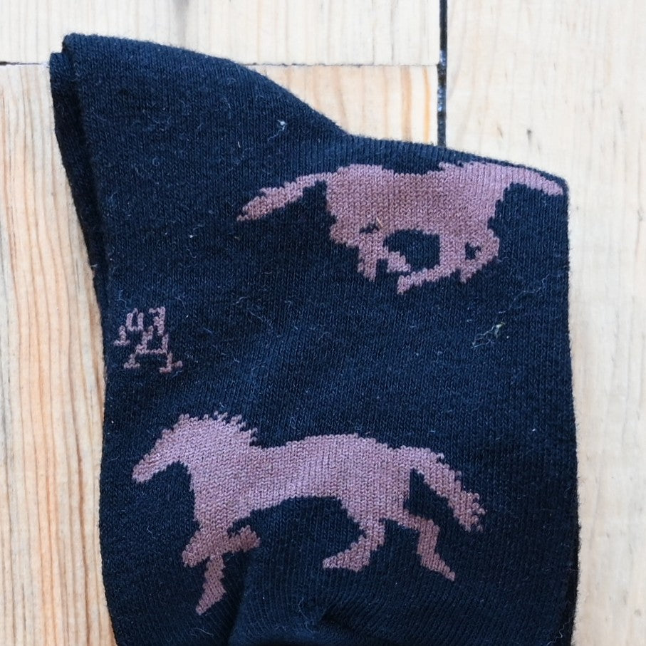 View of Kids Austin Accent Socks in Black with Brown Horses design.