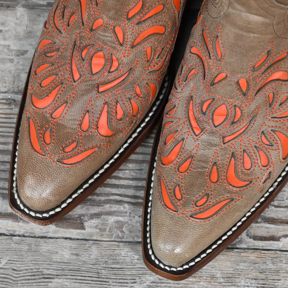 View of Hondo 13" cowboy boot in brown vintage goat with orange inlays and snip toe