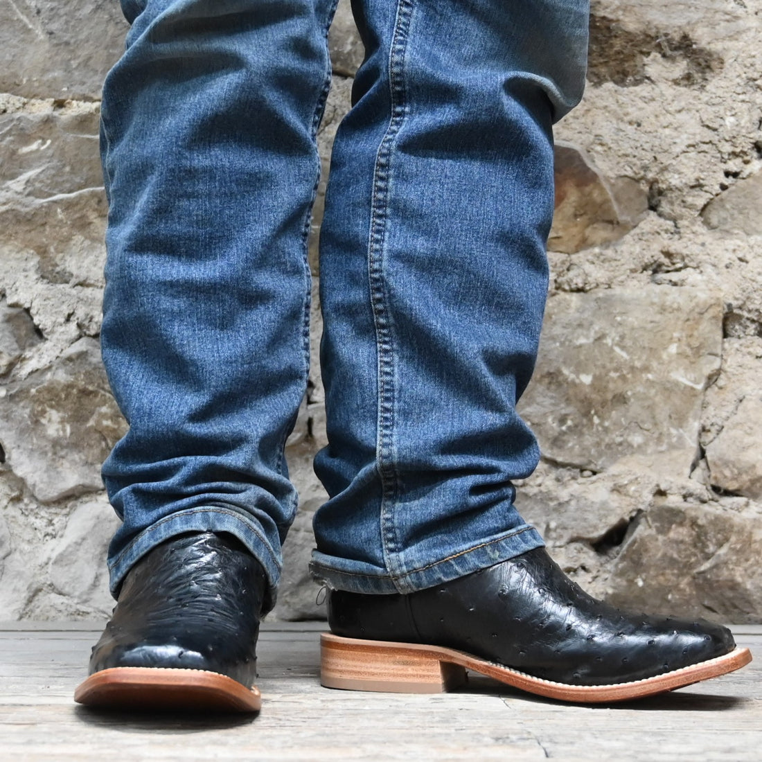 View of Hyer JETMORE 13" boots showcasing black full-quill ostrich vamp and red vintage goat upper with broad square toe and Stockman block heel