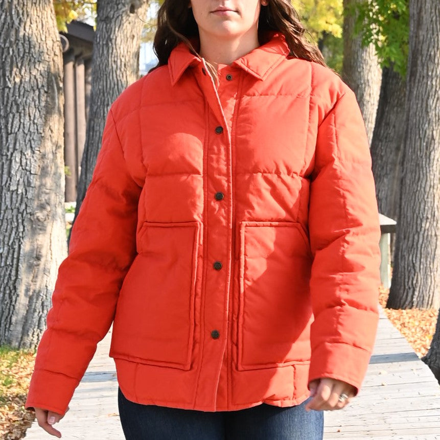 View of Filson Ladies Waxed Down Barn Coat in Campfire featuring antique-finish brass snaps and microfleece-lined hand pockets