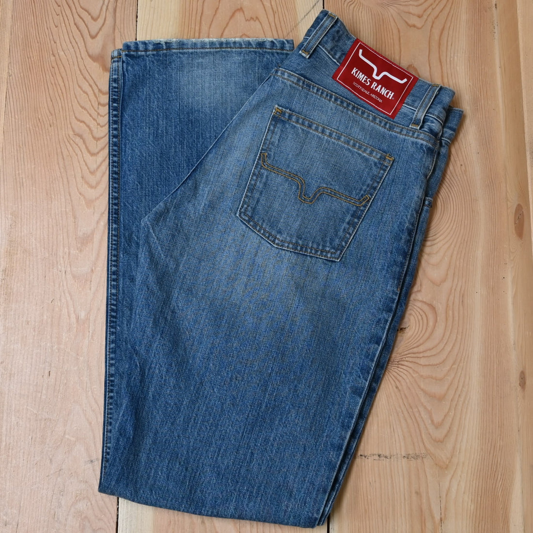 Kimes Brooks Jeans Mid Wash view of pocket and pant leg