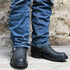 Nicks 12" Leather "Renegade" Motorcycle Boot In Black view of front and side of boot on model size 10.5