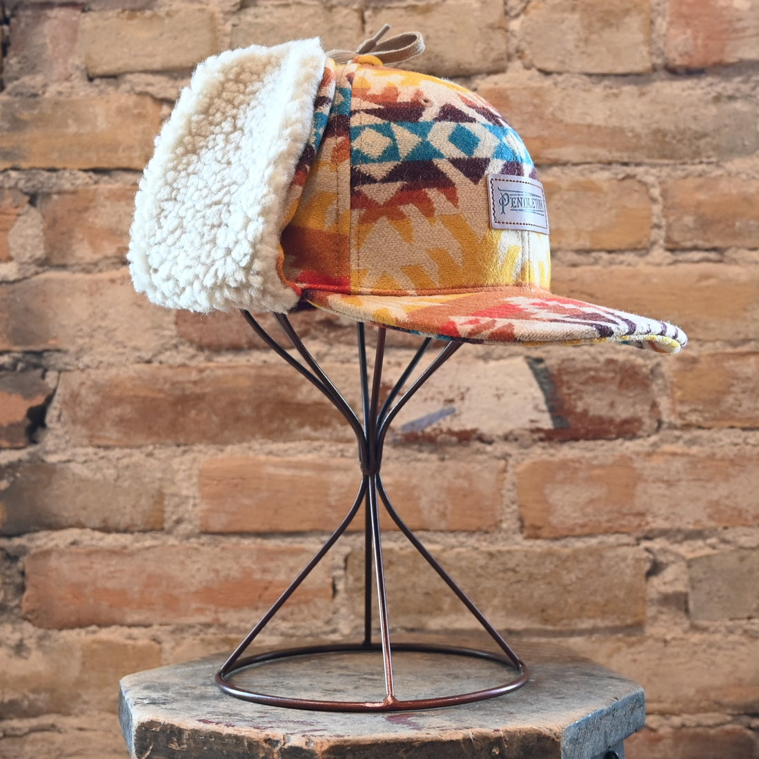 View of Pendleton Timberline wool cap in Pasco pattern with sherpa ear flaps and tie closure