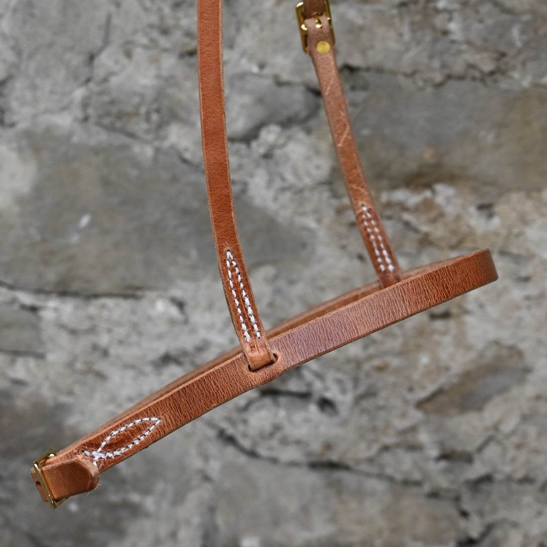 Harness Leather Cavison with Brass Hardware close up view of headstall