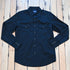 View of Wrangler men’s black Western snap shirt in broadcloth with yokes and flap pockets