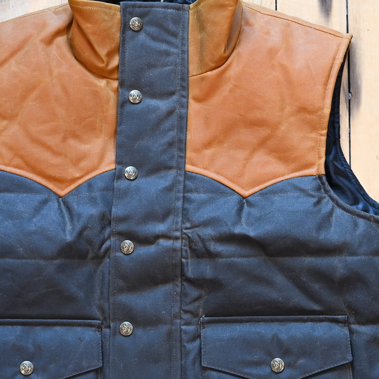 Schaefer Outfitter RangeWax Puffer Vest in waxed cotton canvas with high collar, wool insulation and front utility pockets