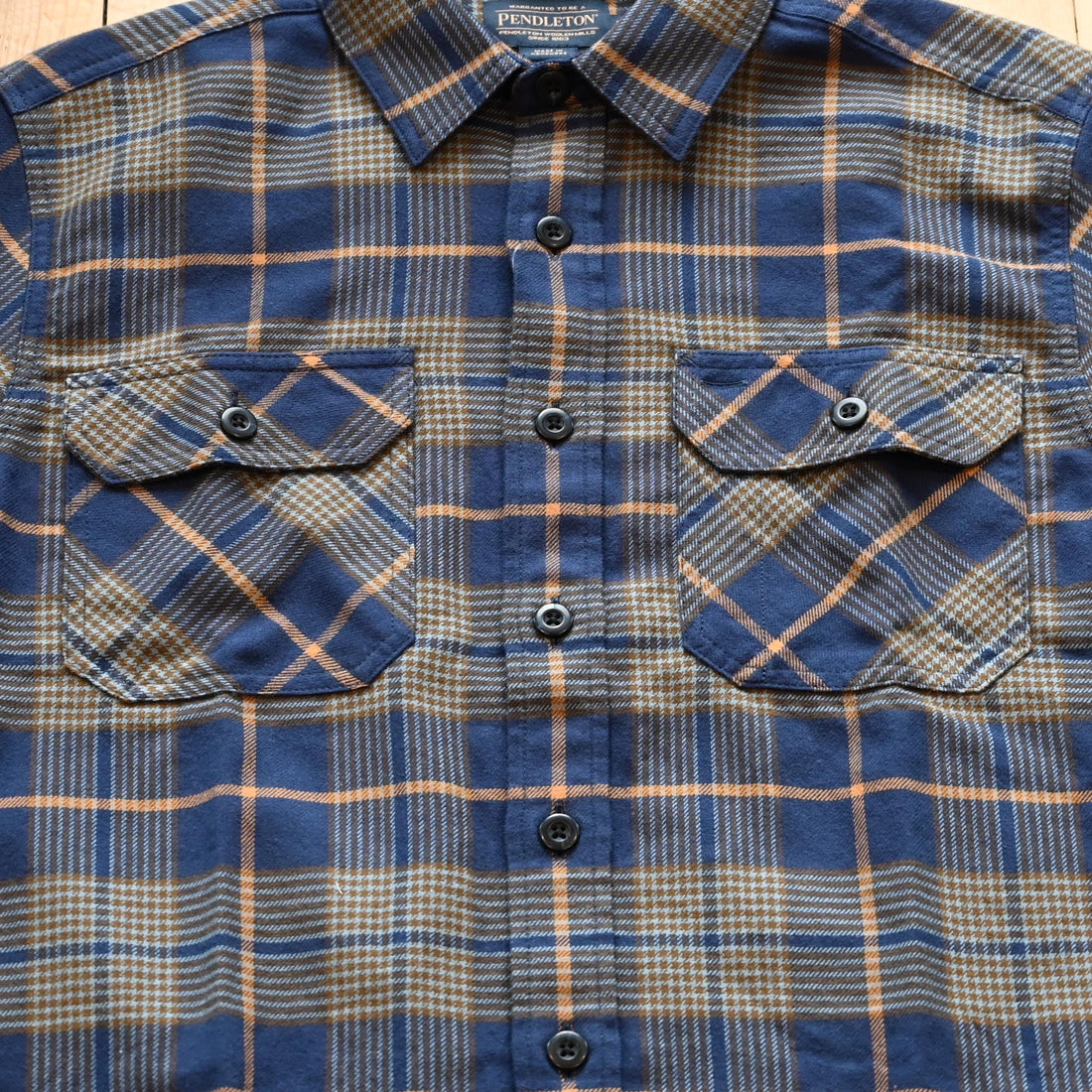 View of Pendleton men’s Burnside flannel shirt in navy and khaki plaid with square hem