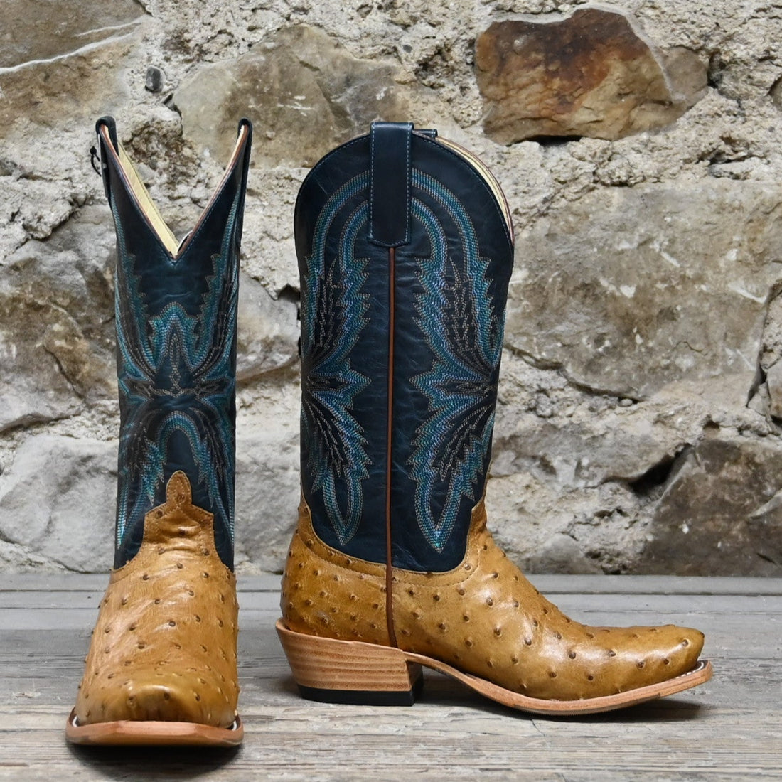 View of Macie Bean 12″ boot with antique saddle ostrich vamp and navy explosion top, TK toe and cowgirl heel
