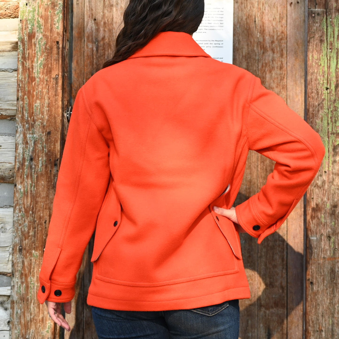 View of Filson Ladies Mackinaw Cruiser in Flame featuring four front cargo pockets and a double-layer back
