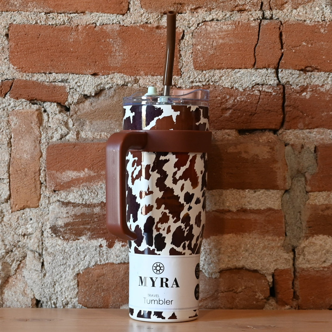 Myra Wide Wyoming brown &amp; white cowhide tumbler with leather accents