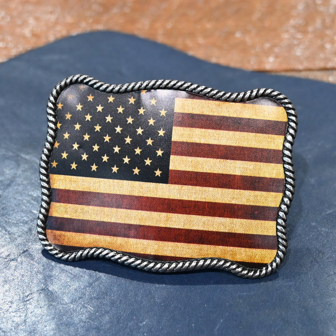 Nocona rectangle USA Flag belt buckle with rope edge border and red, white, and blue design