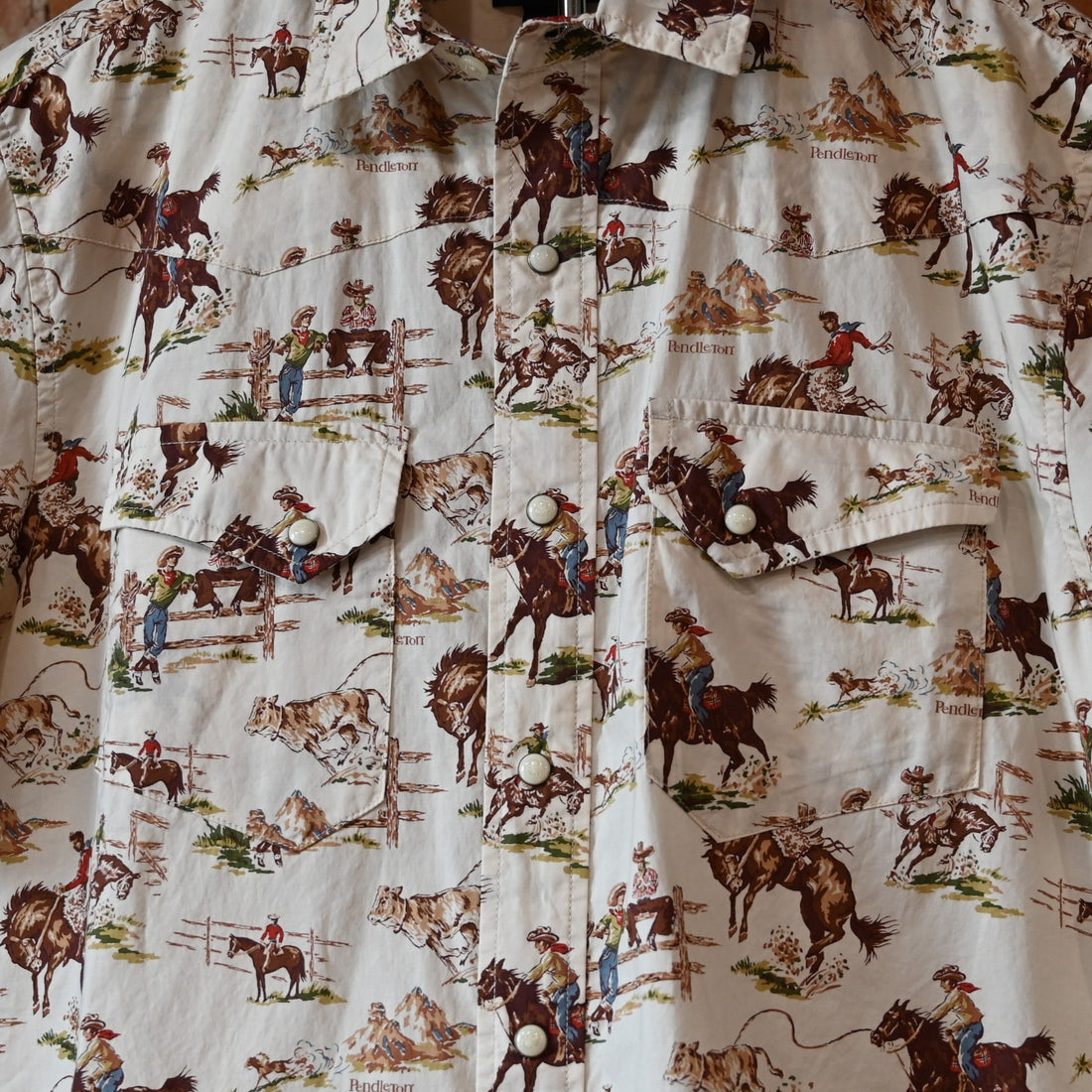 Pendleton men’s Laramie snap-front shirt in Ecru Wild Horses pattern with pearlized snaps and Western yokes